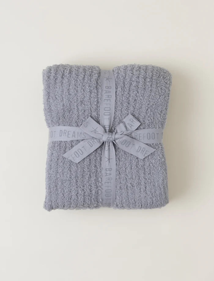 A ribbed knit throw blanket in dove grey with a bow detail, displayed on a plain background.