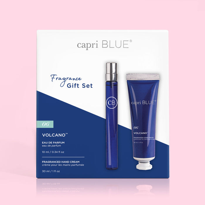 A fragrance gift set by Capri Blue, including a bottle of Volcano Eau de Parfum and a tube of Volcano Mini Hand Cream, packaged in a blue and white box.