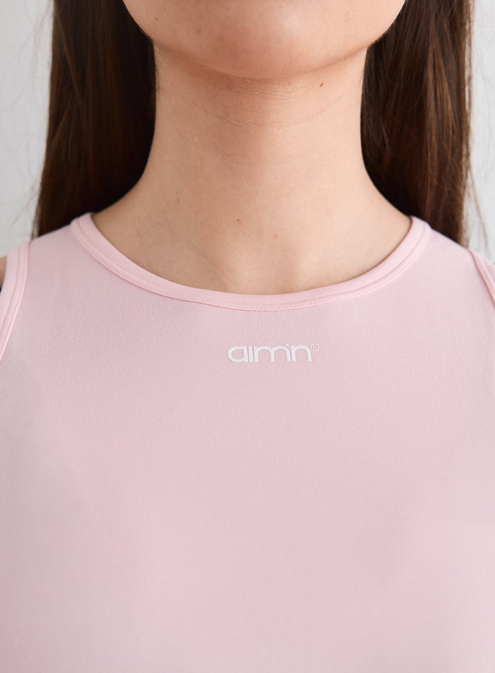 Close-up of the aim'n logo on the Ballerina Soft Basic Singlet [L-174cm]