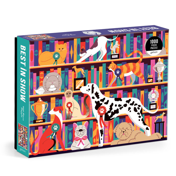 A colorful puzzle box featuring illustrated images of cats and dogs with trophies and books on shelves, indicating a 'Best in Show' theme.