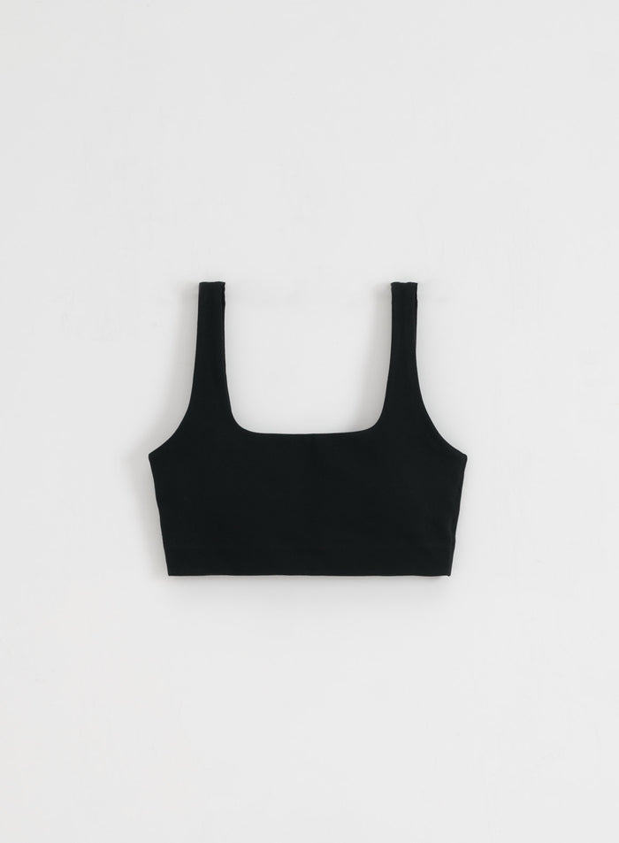 Black square-cut Sense Bra in buttery soft activewear fabric, flatlay view.