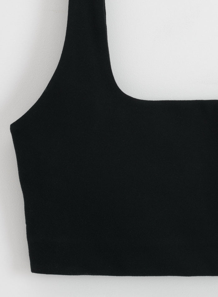 Black aim'n Sense Bra featuring a square neckline and buttery soft fabric in a close-up view.