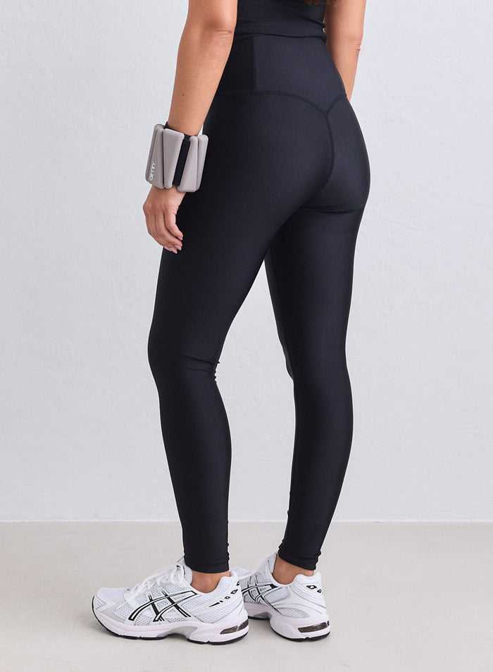 High-waisted black shimmer tights by aim'n featuring a metallic finish and supportive stretch fit. [XS-165cm]
