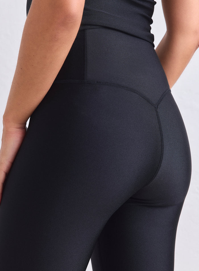 Black high-waisted Shimmer Tights from aim'n with a subtle sheen and back seam detail. [XS-165cm]