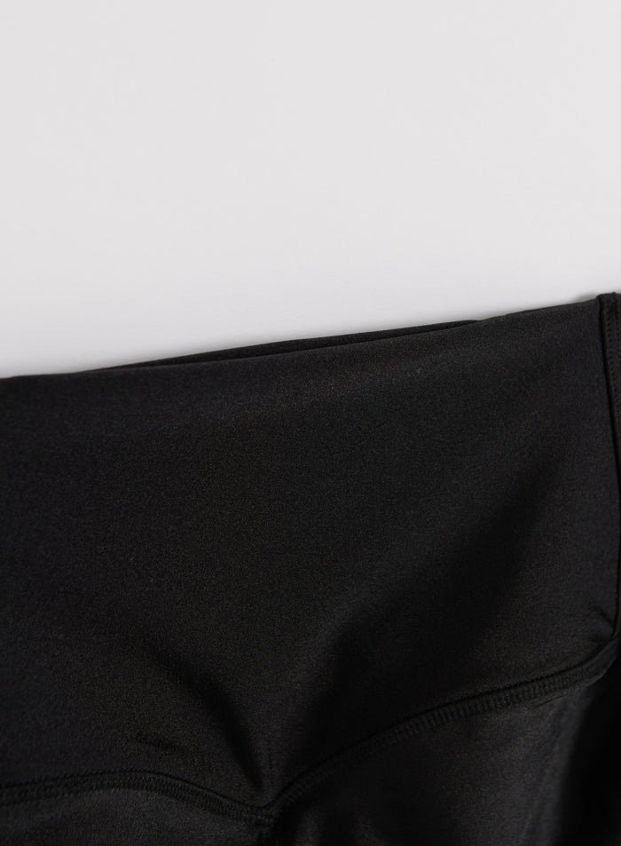 Close-up of the high-rise waistband on these black shimmer tights by aim'n, highlighting the metallic fabric.