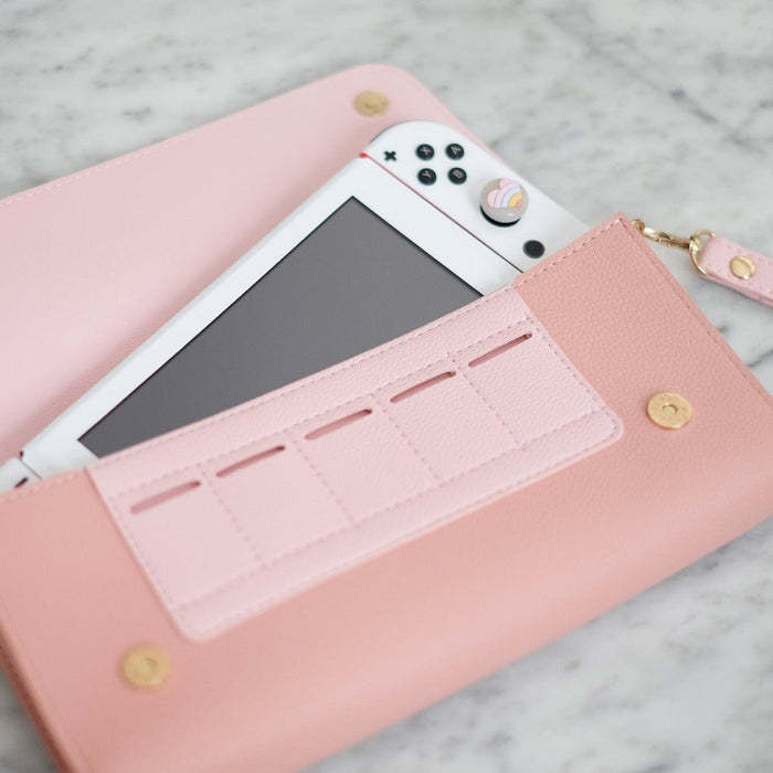 Interior view of blush pink Switch travel pouch showing 5 game card slots