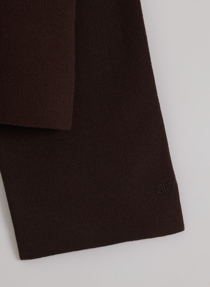 Chocolate brown soft knit long sleeve featuring a tonal embroidered aim'n logo.