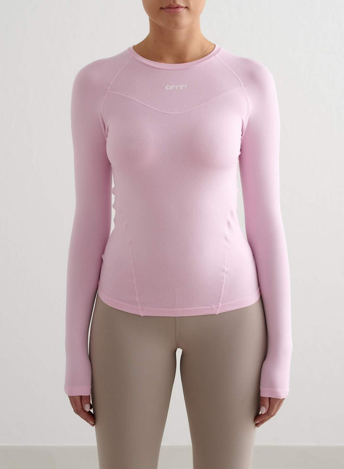 Cotton candy pink aim'n Soft Basic Long Sleeve with a second skin feel, round neckline, and raglan sleeves.