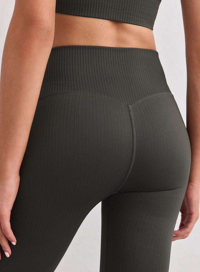 Close-up of Dark Ivy ribbed seamless flare tights by aim'n featuring a high waist and supportive fit. [S-178cm]
