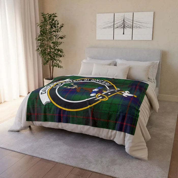 Davidson tartan crest throw blanket — lightweight polyester, hemmed edges, bedroom setting