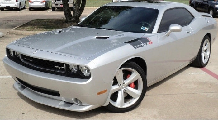 A silver Dodge Charger car parked outdoors.