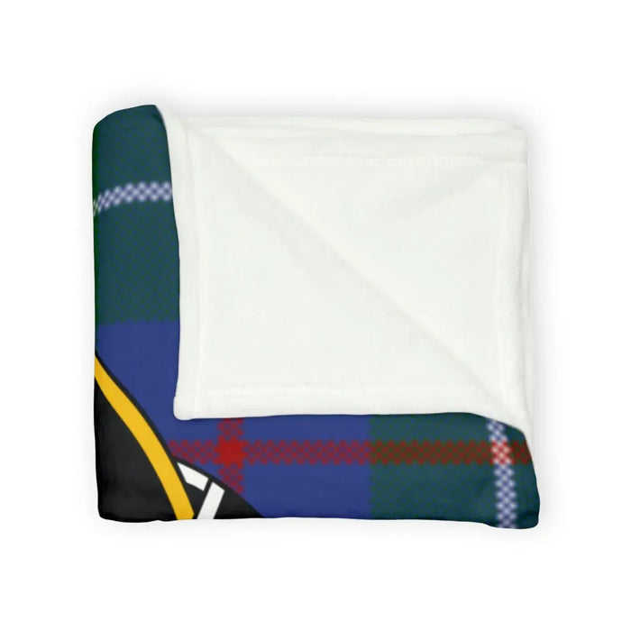 Duncan crest design on a tartan background throw blanket on sofa — lightweight printed polyester