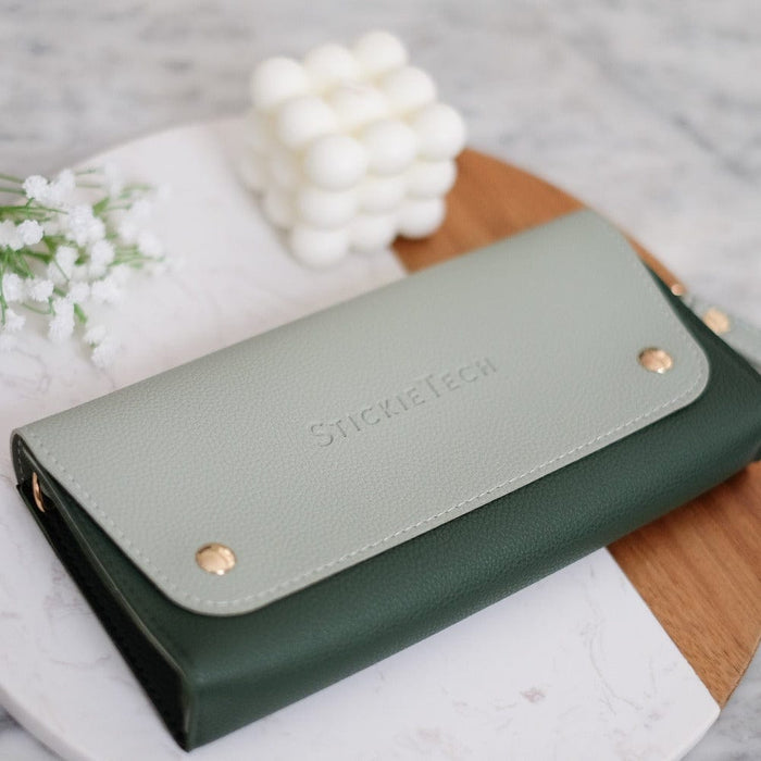 Evergreen green Nintendo Switch travel pouch with gold hardware and wrist strap