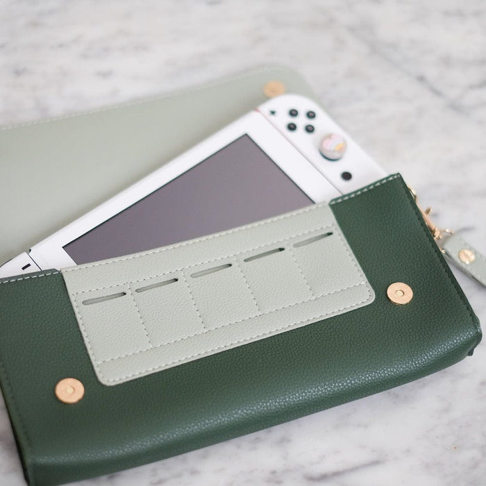 Interior view of evergreen Switch travel pouch showing 5 game card slots