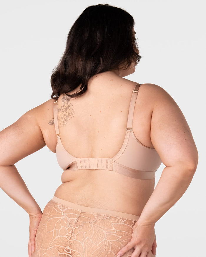 Rear view of model wearing the Hotmilk Flawless Plunge Wirefree Nursing Bra in Cashmere – showing 6-hook back closure, gold adjustable straps, and double-layer smoothing back panel with matching lace briefs