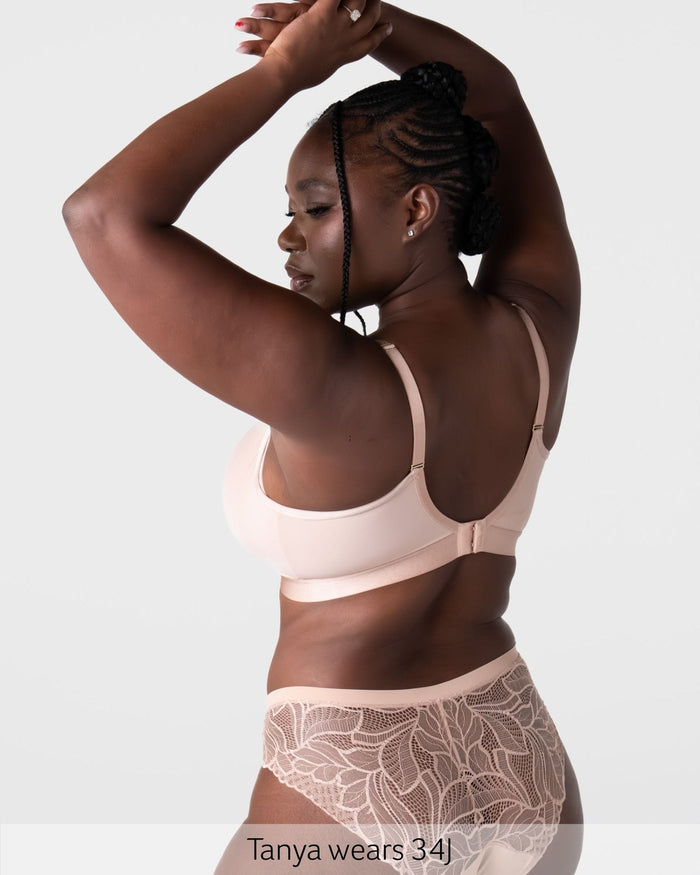 Rear view of model wearing the Hotmilk Flawless Plunge Wirefree Nursing Bra in Cashmere – showing 6-hook back closure, gold-tone adjustable straps, and matching lace briefs