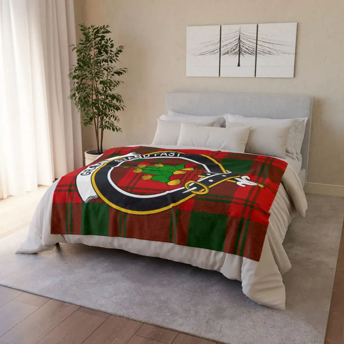 Grant clan tartan throw blanket on bed — lightweight polyester, cosy plaid design