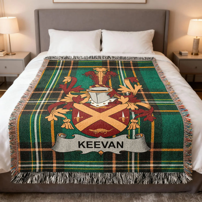 Keevan Irish family crest woven blanket displayed on a bed.