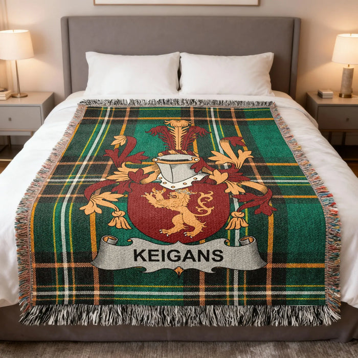 Keigans Irish family crest woven blanket displayed on a bed.