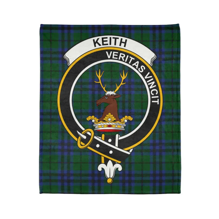 Keith printed throw laid flat with Veritas Vincit crest