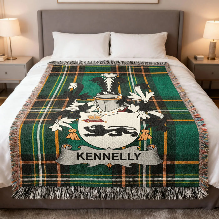 Green plaid throw blanket with Kennelly crest centered on bed.