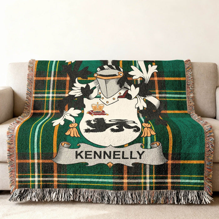 Kennelly family crest on green and black plaid throw blanket on couch.