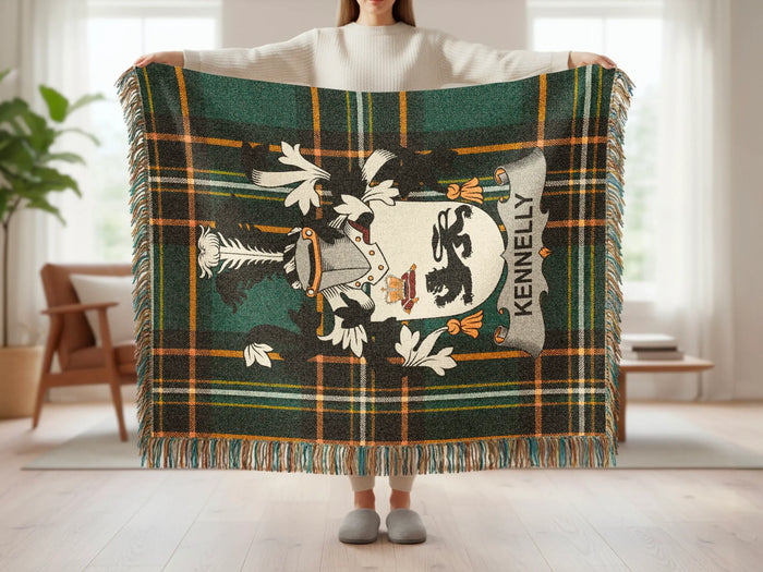 Green and black plaid throw blanket with a crest and "KENNELLY" text.