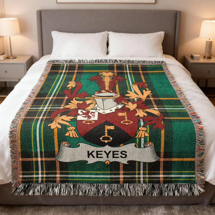 Keyes Irish family crest woven blanket displayed on a bed.