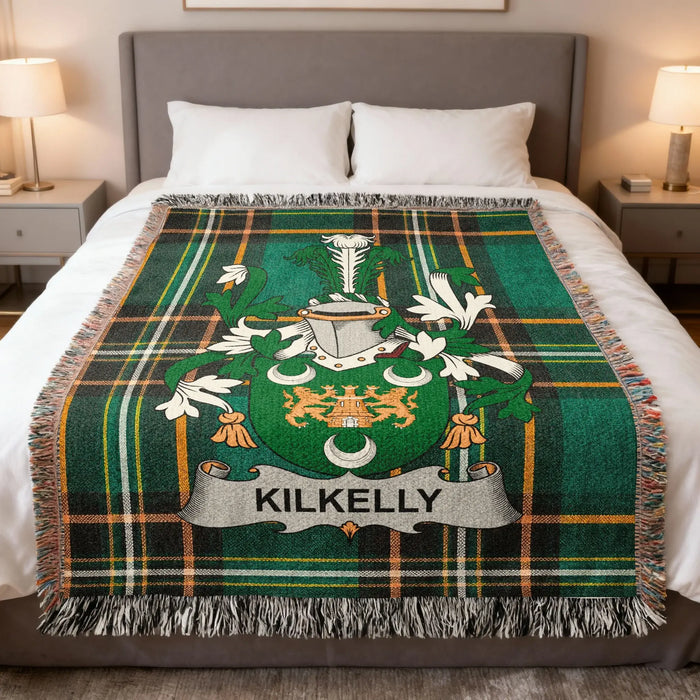 Kilkelly Irish family crest woven blanket displayed on a bed.