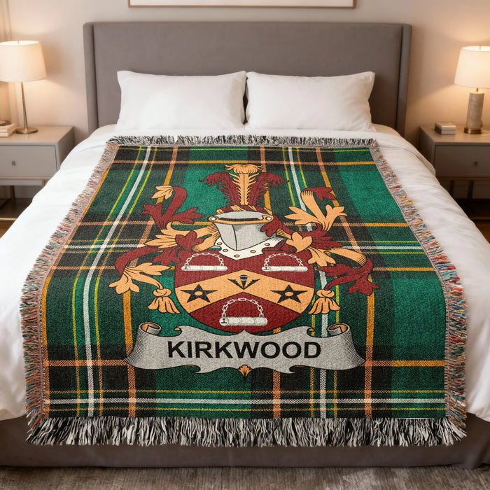 Kirkwood Irish family crest woven blanket displayed on a bed.