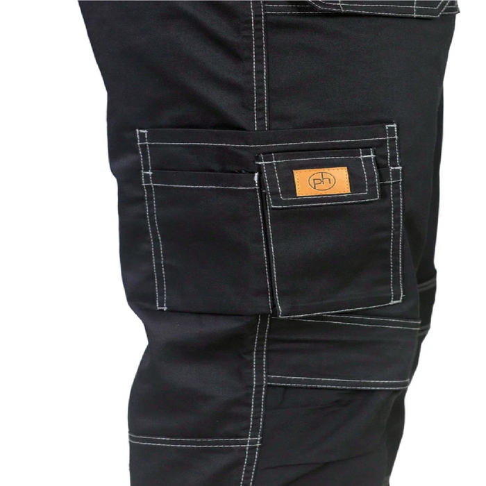 Close-up of black pants with a brand logo on the pocket against a white background