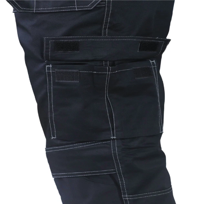 Close-up of dark blue pants with multiple pockets on a white background