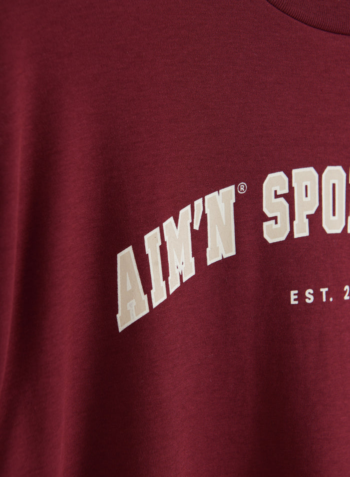 Merlot organic cotton jersey t-shirt featuring a varsity-inspired beige aim'n print.
