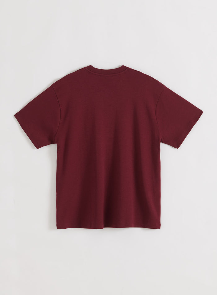 Merlot Varsity Boyfriend T-shirt by aim'n shown from the back in a soft, oversized jersey flatlay.