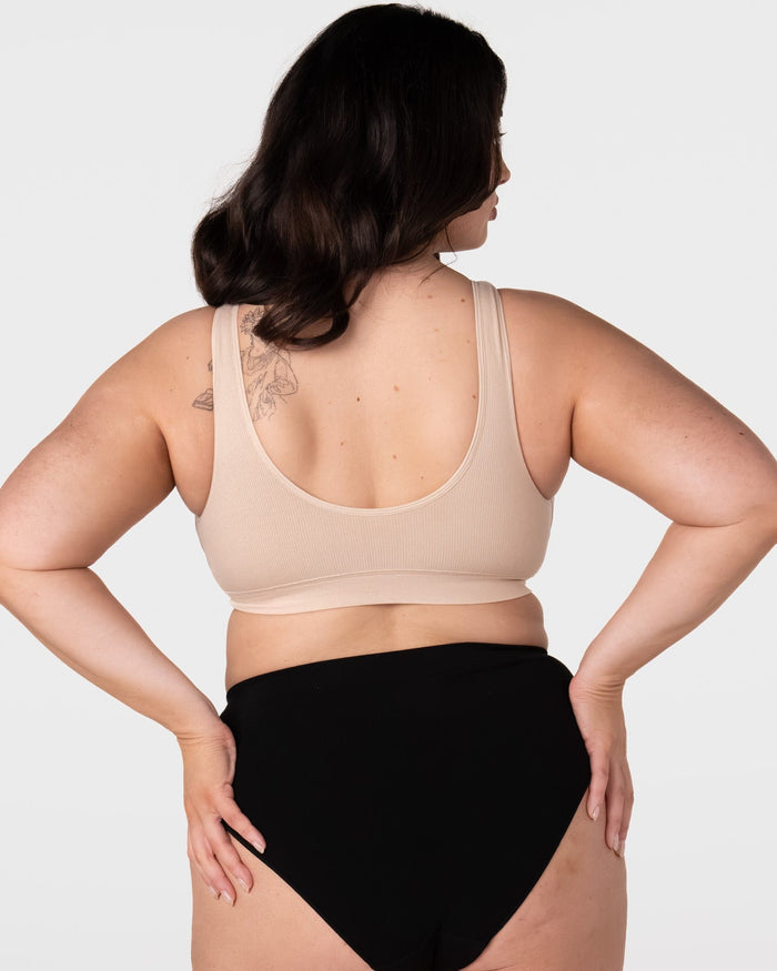 Rear view of model wearing the Hotmilk My Comfort Nursing Bra in Oat – showing smooth pullover back, wide non-adjustable straps, and seamless ribbed construction