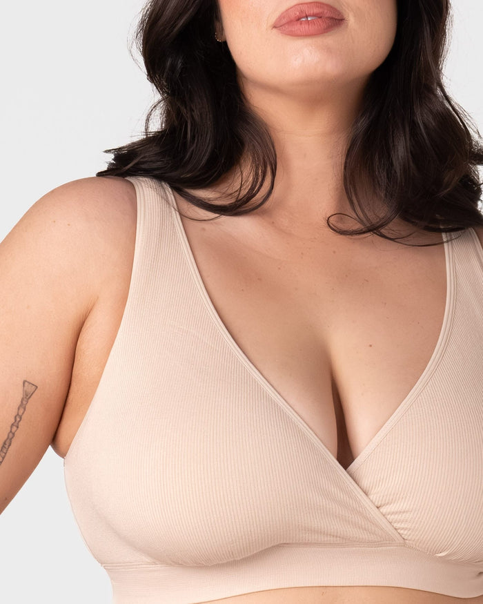 Close-up front view of the Hotmilk My Comfort Nursing Bra in Oat – showing soft ribbed bamboo-blend fabric, wide smoothing straps, and deep plunge wrap neckline