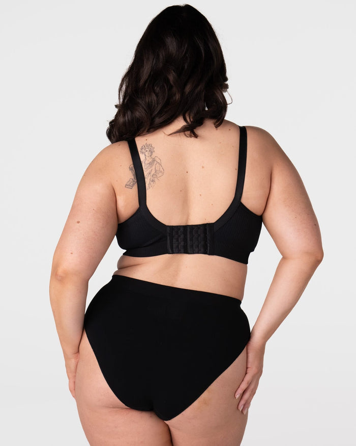 Rear view of model wearing the Hotmilk My Everyday FlexFit Nursing Bra in Black Busty – showing 6-hook wide back closure and fully adjustable straps