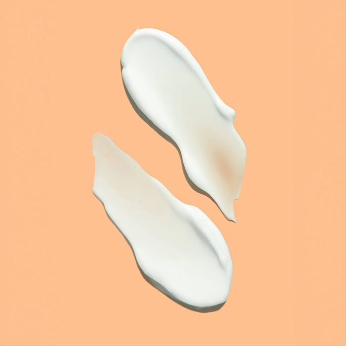 cosmetic sample against an orange background